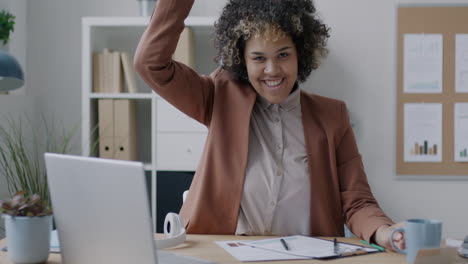 woman celebrating success in office