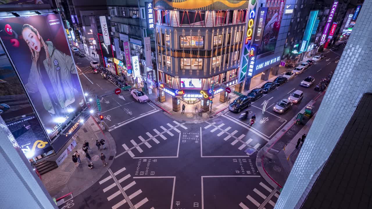 Vibrant Night Timelapse of Pedestrians and Traffic Flow at the Bustling Ximen Intersection in Central Taipei, Taiwan, Illuminated by City Lights