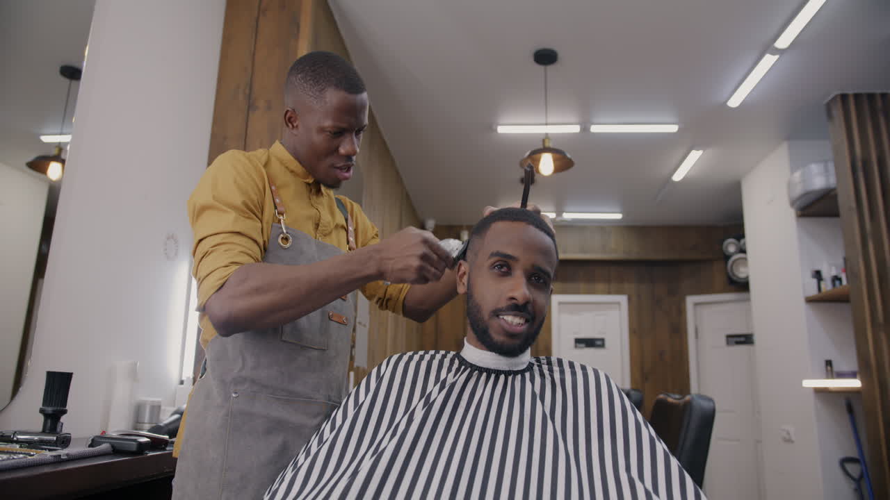 Barber giving a haircut to a customer