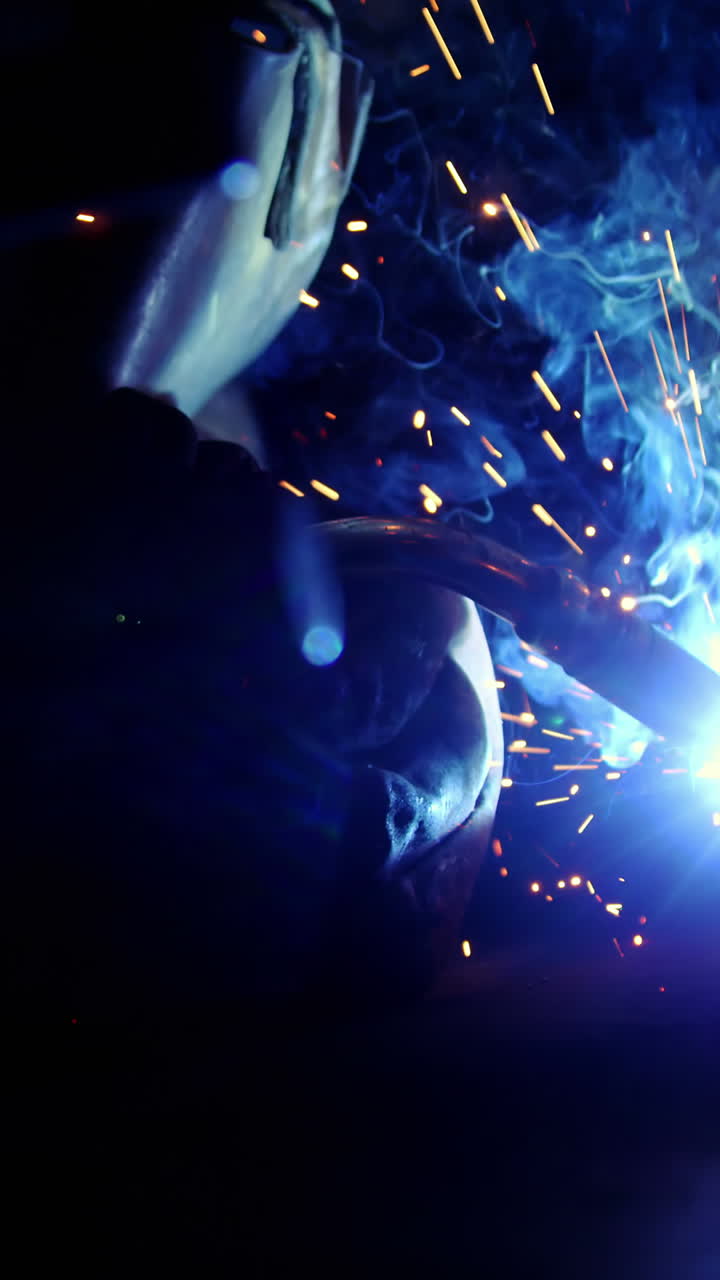 Welder working on a piece of metal