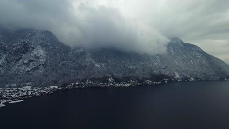 Footage-filmed-with-a-drone-over-a-lake-by-a-town-called-Hallstatt-in-Austria-in-Europe