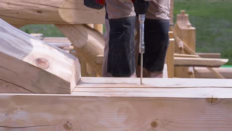 log cabin construction with drill