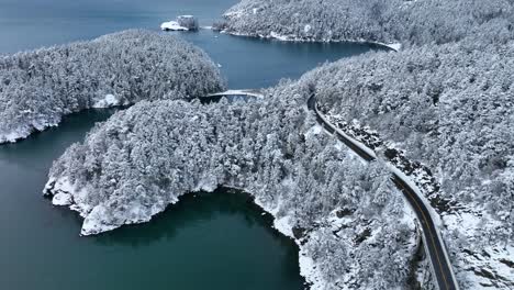 Drone-shot-of-Anacortes-covered-in-snow-with-Bowman-Bay-in-the-background