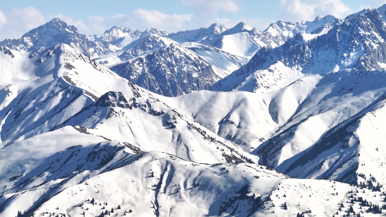Winter aerial landscape of Terskey Alatau mountain range in Eastern Kyrgyzstan. Snowy high mountains