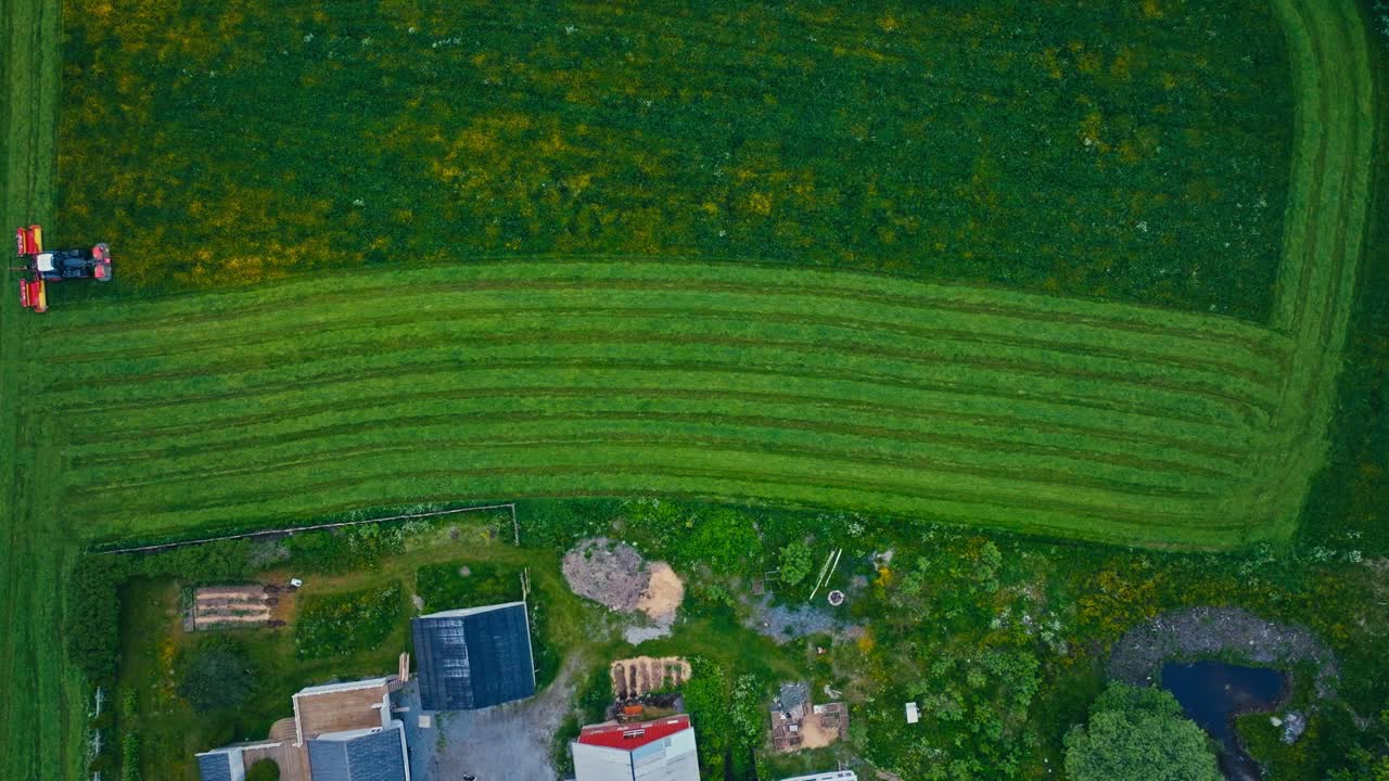 Aerial View Of Farm Tractor Working In The Field - Drone Shot