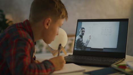 boy doing online math homework