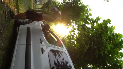 VERTICAL-van-lifer-male-model-wearing-a-t-shirt-at-early-morning-sunset-ready-fo-start-a-new-van-life-adventure