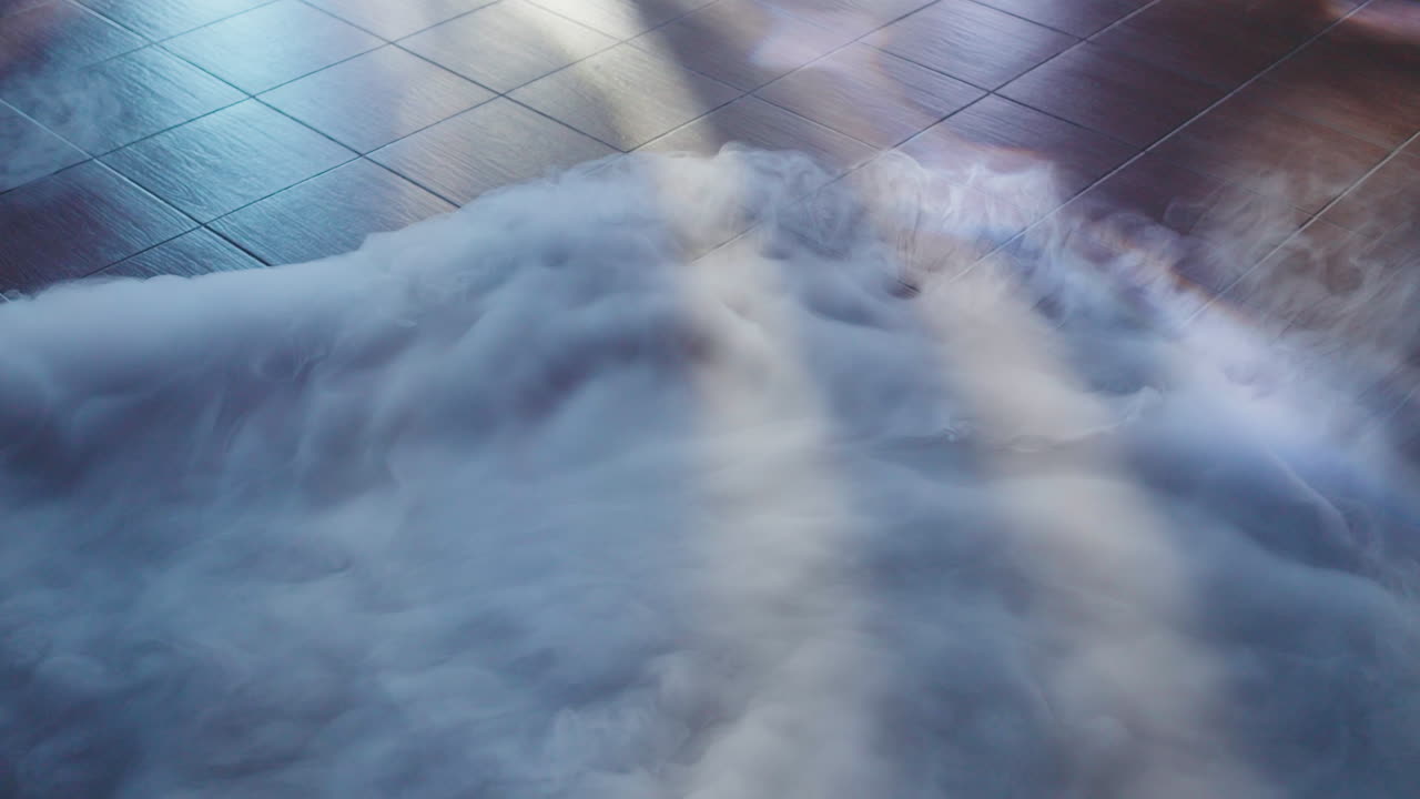 Low-lying smoke spreading over a tiled floor, creating a mysterious and ethereal atmosphere