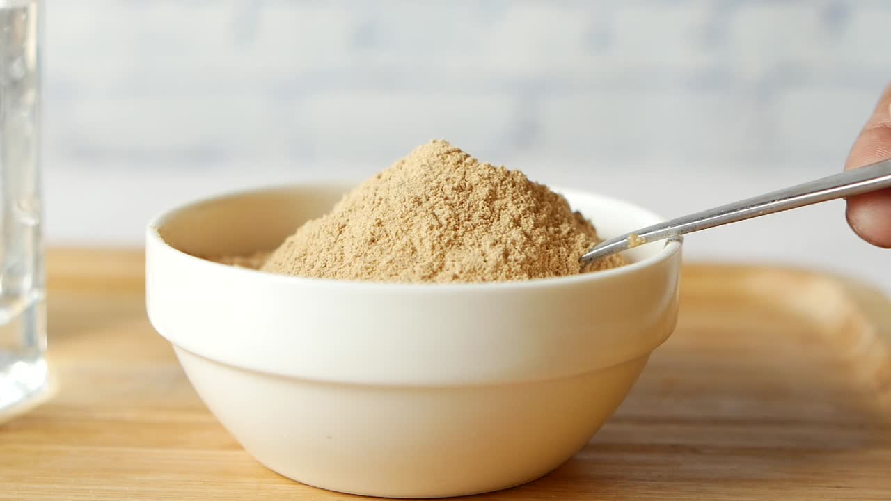 Powder in a bowl with a spoon