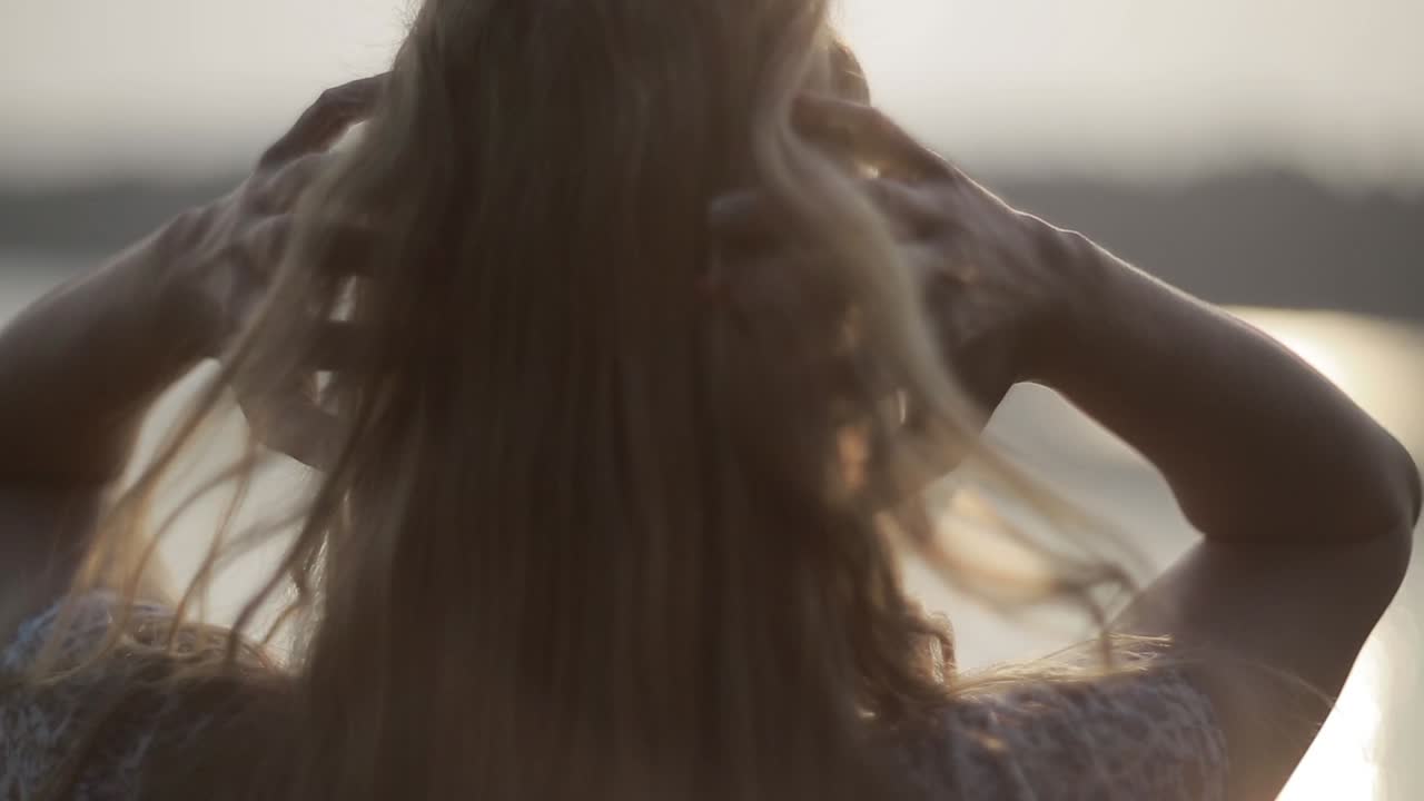 Dreaming Girl With River On Background. Woman relaxes by the lake, sunny joyful summer day or evening concept