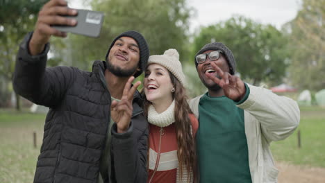 selfie, camping and peace sign with friends