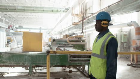 man walking in a marble factory