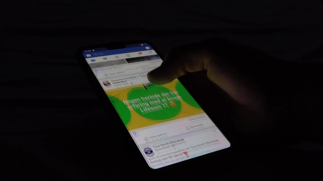 Scrolling tough social media, on a smartphone.
