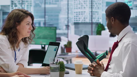 hr recruiters team interviewing a candidate with crutches in office