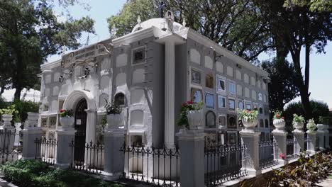 Pan-across-large-elegant-mausoleum-in-cemetery-with-niches-for-remains