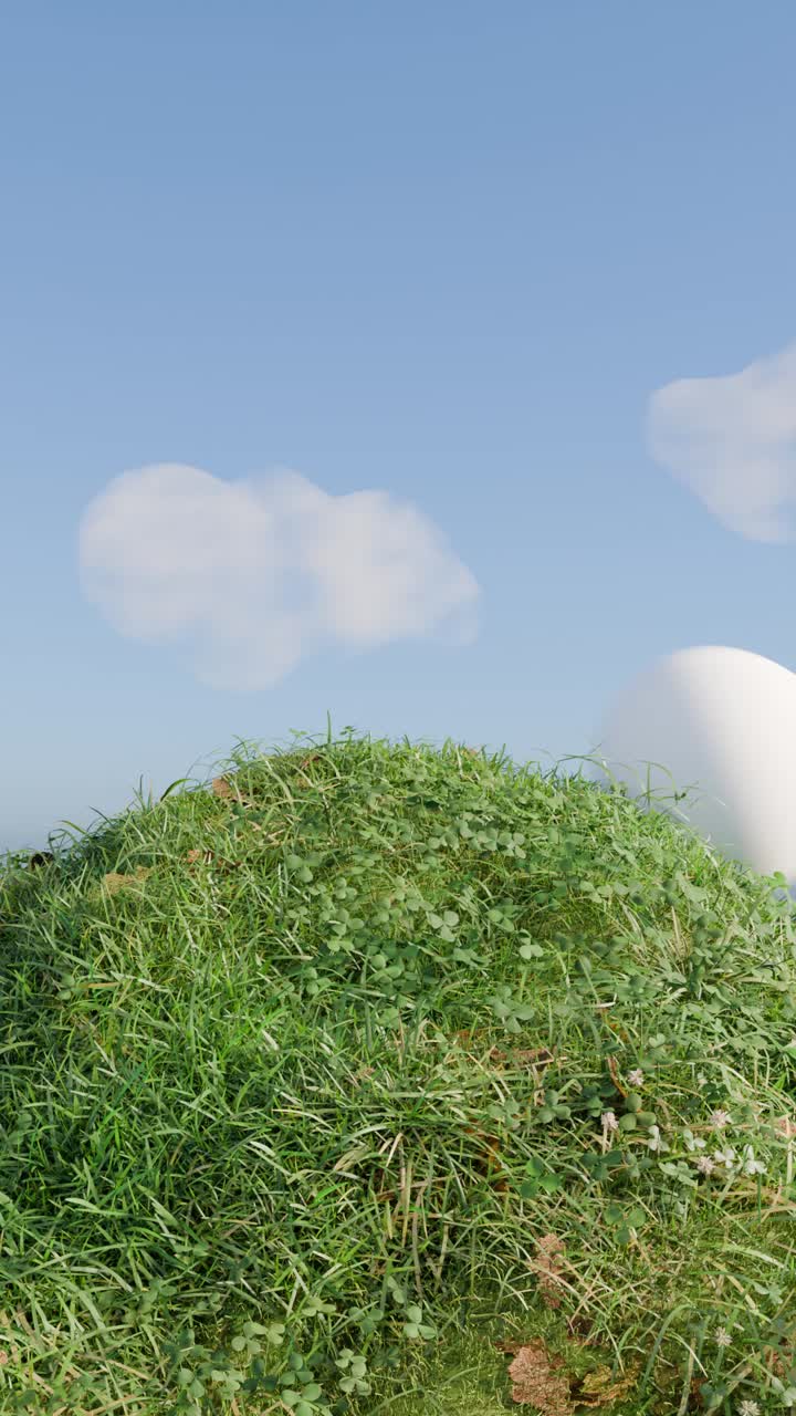 구름이 가득한 하늘 아래의 잔디 언덕