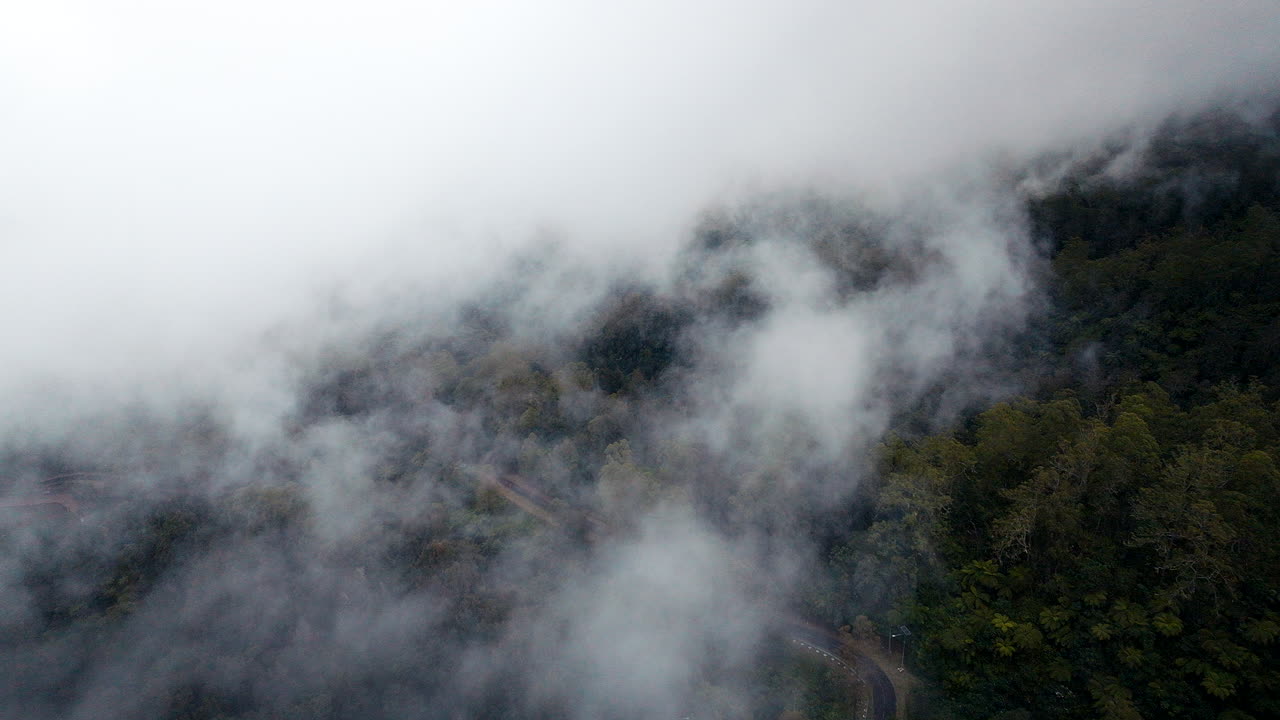 Flying Through Clouds Over Mount Agung Hillside During Sunrise In Bali, Indonesia