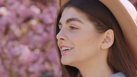 woman in profile view with cherry blossoms