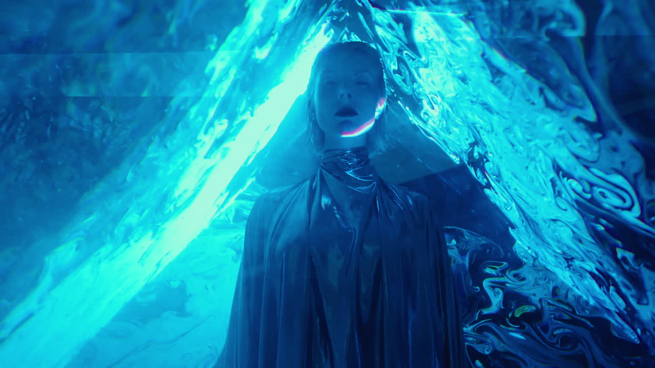 Female Model in Silver Gown Posing in Laser Light Tunnel