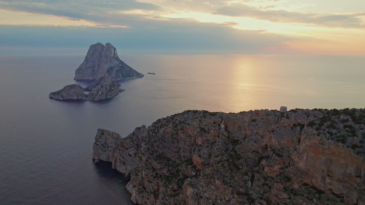 Tranquil Seascape And Es Vedr&agrave; Island In Ibiza, Spain - aerial drone shot