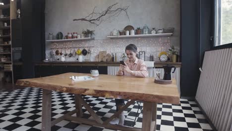 woman relaxing in a stylish kitchen