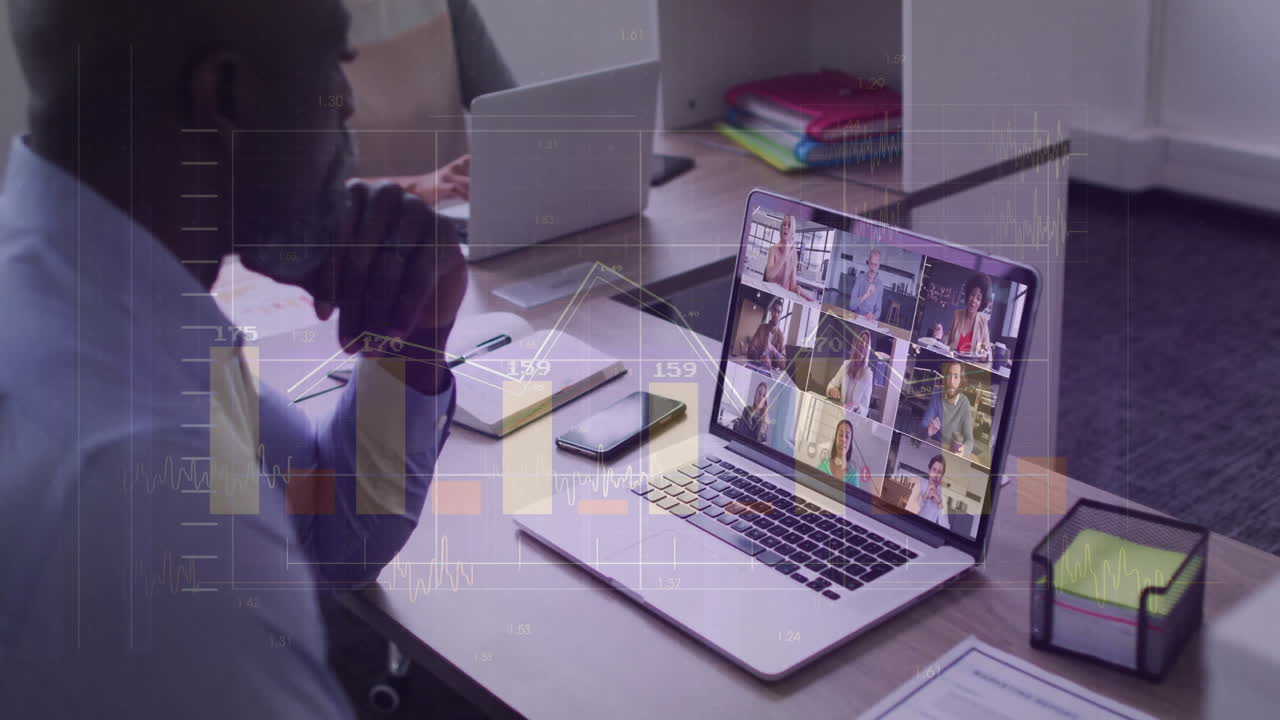 In office, businessman in virtual meeting, viewing data analytics on laptop screen