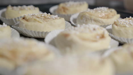 Medium-slide-shot-of-cinnamon-buns-on-a-tray