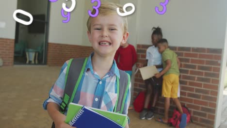 Animation-of-numbers-moving-over-happy-caucasian-schoolboy-smiling-in-school-corridor