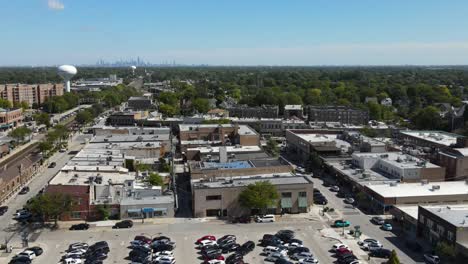 la grange, il on a sunny fall day, showcasing streets, buildings, and the suburban landscape with downtown chicago in background. orbit right zoom day e