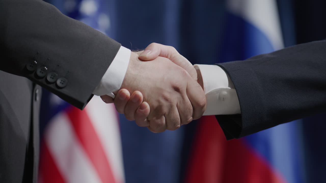 Close-Up of Political Leaders Shaking Hands at Global Press Conference