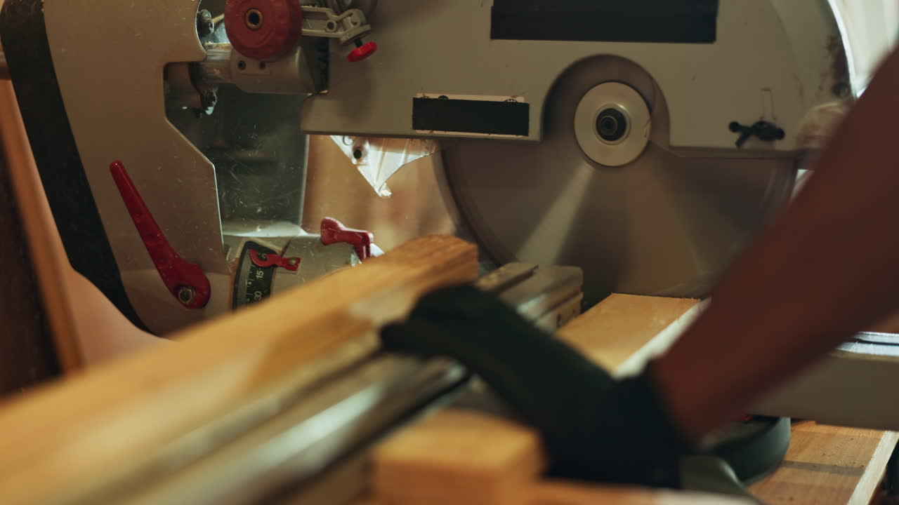 Miter saw cutting wood