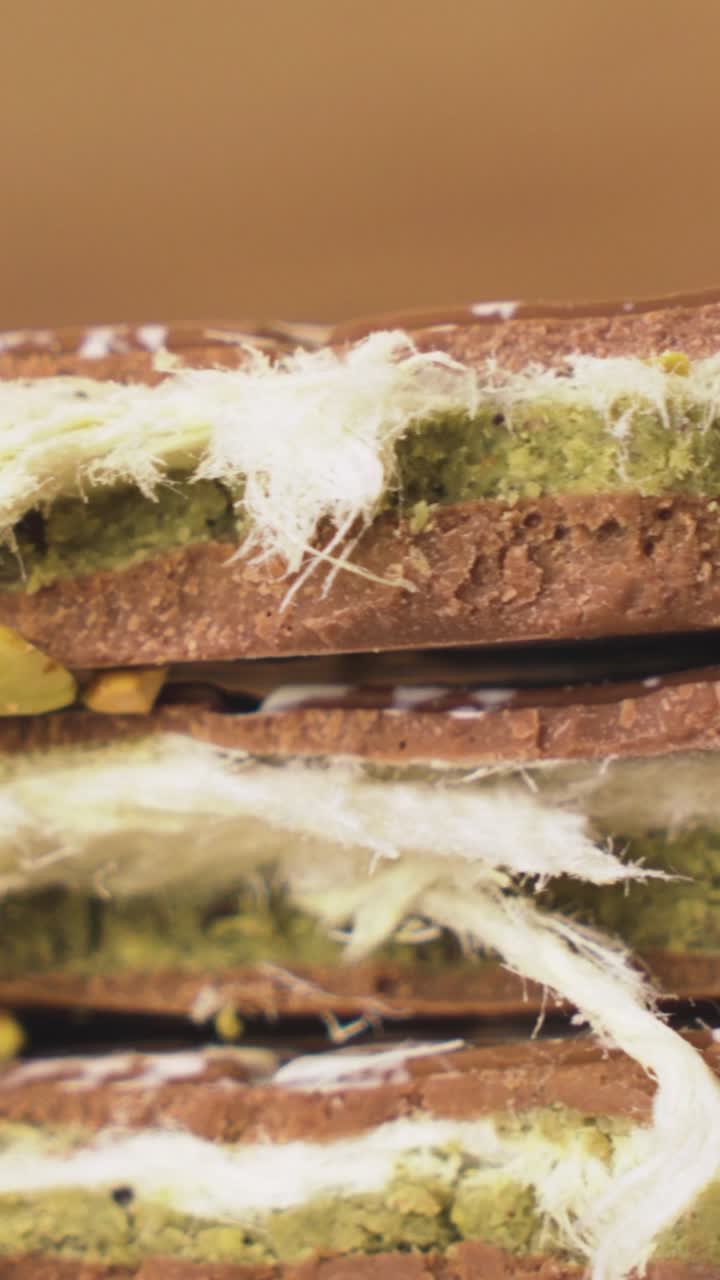 Exquisite handcrafted Dubai chocolate presented in vertical composition, layered with premium crushed nuts for a luxurious dessert visual