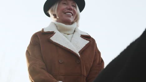 Closeup-woman-horseriding-at-the-farm