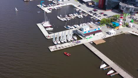 aerial view of a marina with sailboats and people