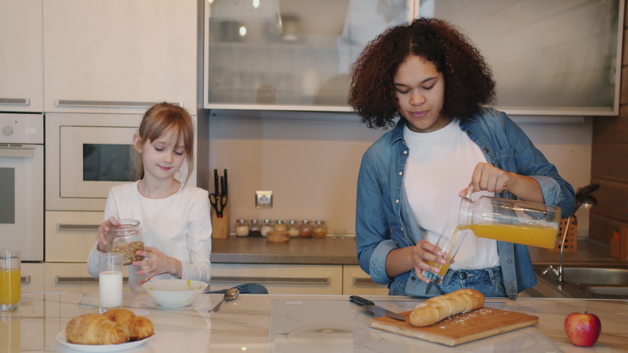 Sisters Having Breakfast in the Kitchen
