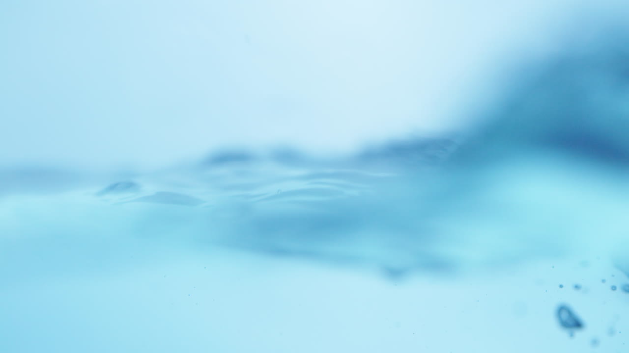 Engaging imagery of swirling water, showcasing the beauty and clarity of drinking water in a captivating slow-motion view.