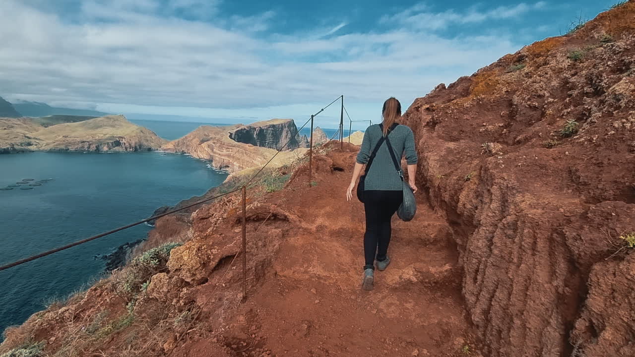 Woman hiking a mountain trail in Ponta de Sao Lourenco, Madeira