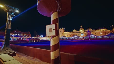 panoramic view of chez ali at night in marrakesh, morocco.famous landmark for entertainment and folklore shows.