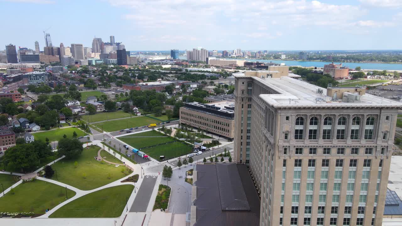 Detroit city skyline and recently restored Michigan Central Station building, aerial orbit view
