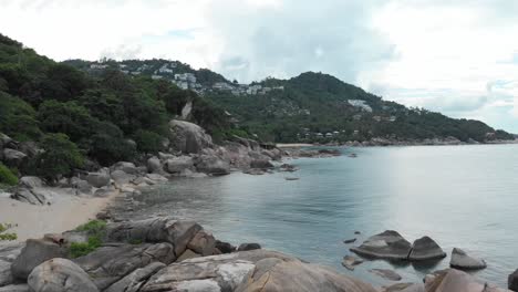 Hidden-Beach-surrounded-by-Stones-and-Luxury-Resorts-on-Koh-Tao-Thailand