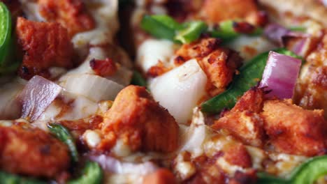 delicious close-up of chicken pizza with onions and peppers