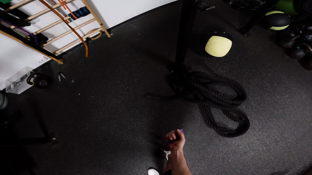 Person using hand grips in a gym