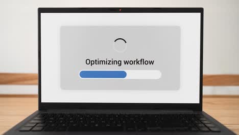 ai doing workflow optimization on a laptop with progress bar on the screen.