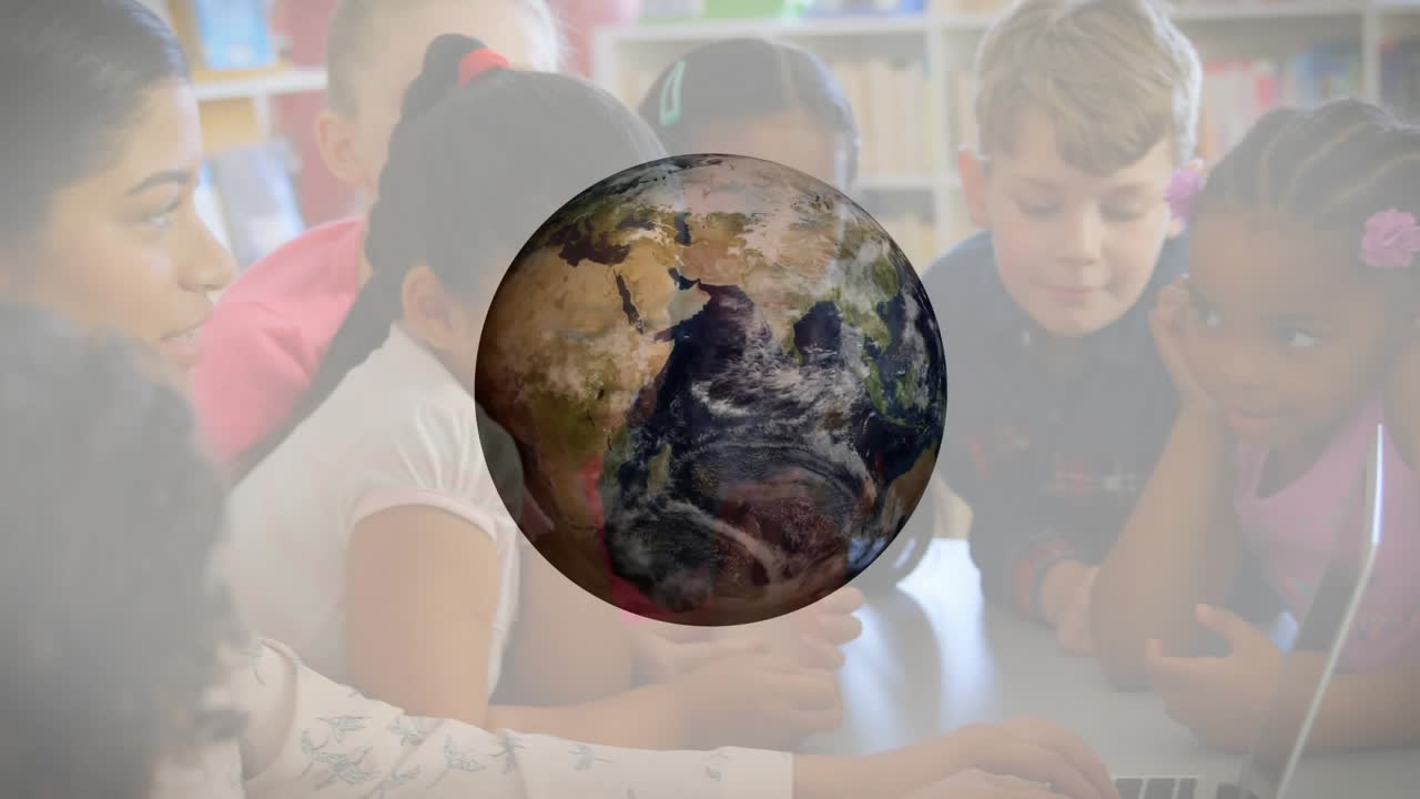 Globe appearing above laptop causing teacher typing and students leaning in during geography lesson