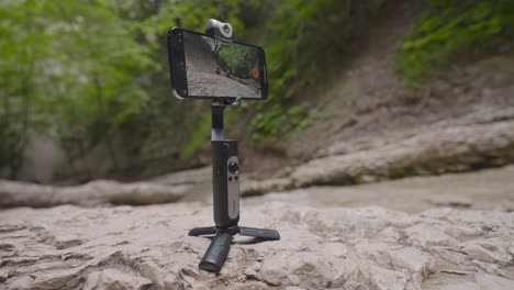 smartphone with stabilizer in nature