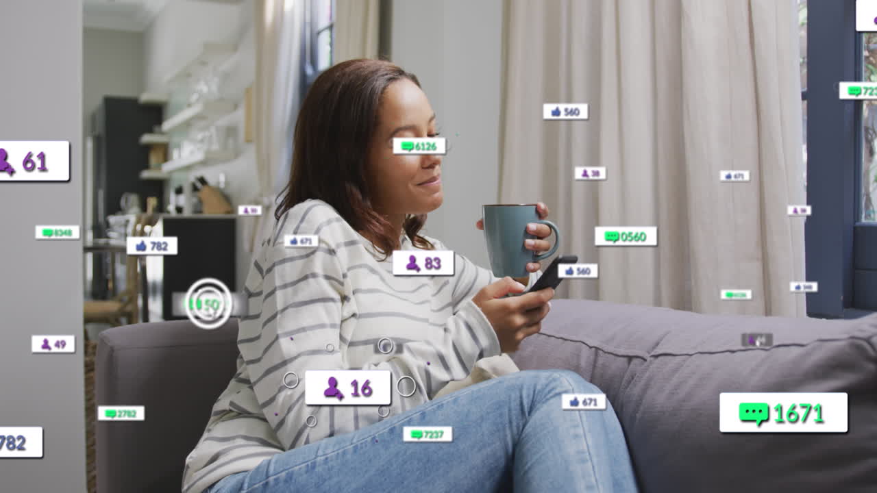 Animation of social media text and icons over caucasian woman with smartphone at home