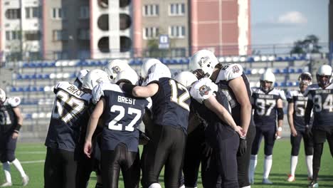 american football team huddle