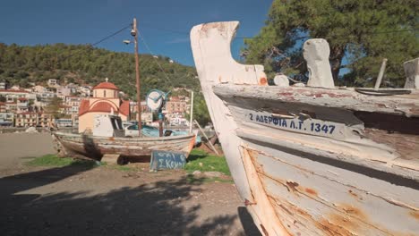 old neglected greek fishing boats abandoned on coastal boat yard