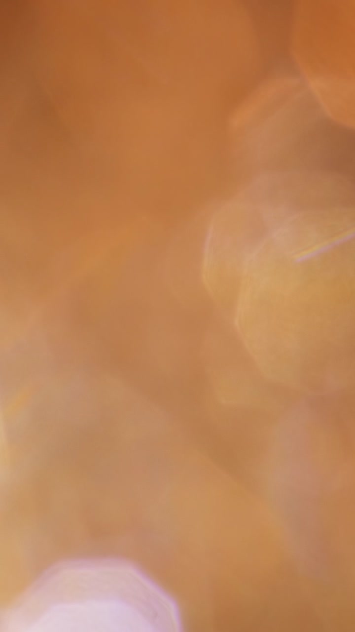Transizione Astratta di Bagliori di Luce Bokeh Arancione Caldo