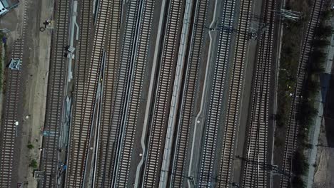 psychedelic and dynamic shot of train tracks of a big metropolitan metro system in large european city. 4k without wagons passing by, shot during sunrise.